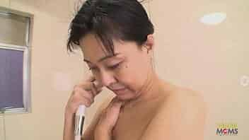 Chubby Japanese mom shows off her curves and lets him touch her inappropriately. The man teases her pussy with a vibrator, and then they hop into the shower before having sex ending with a creampie. video